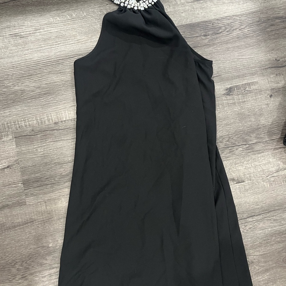 Elegant Black Sleeveless Dress with Embellished Neckline